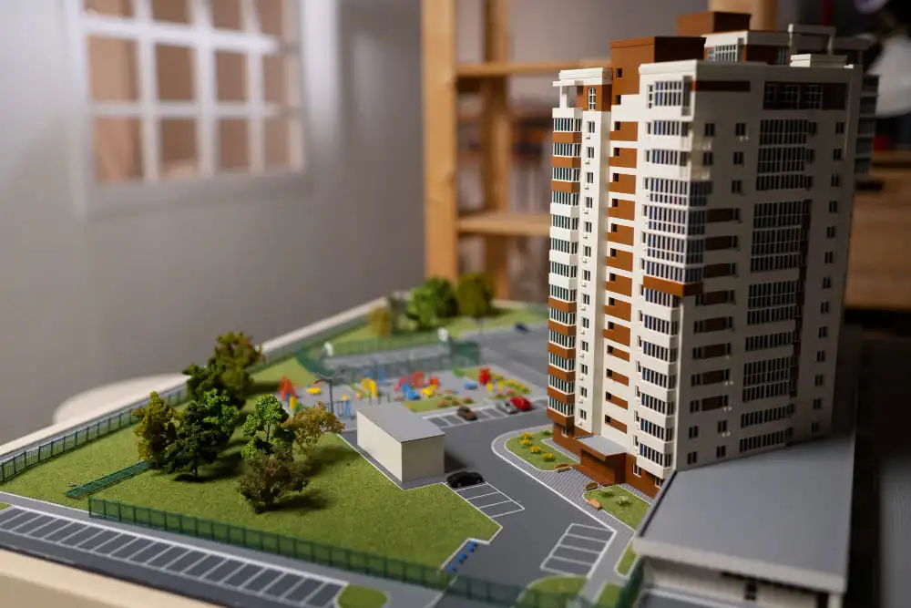 A model of an apartment complex: a scaled-down version displaying the building's design and layout.